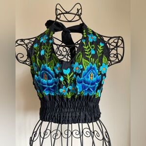 Halter top with embroidery in black , green and blue